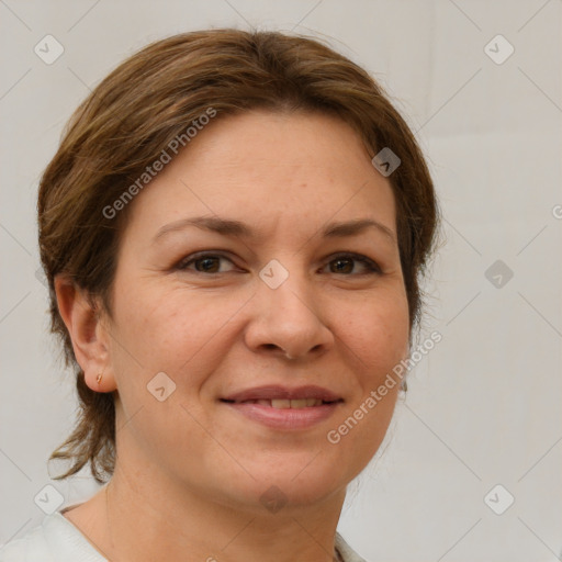 Joyful white adult female with short  brown hair and grey eyes