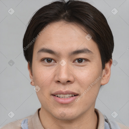 Joyful asian young-adult male with short  brown hair and brown eyes