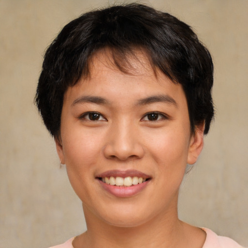Joyful asian young-adult female with short  brown hair and brown eyes
