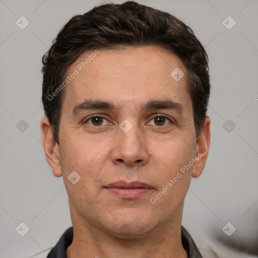 Joyful white adult male with short  brown hair and brown eyes