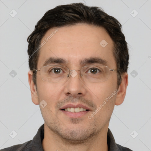 Joyful white adult male with short  brown hair and brown eyes