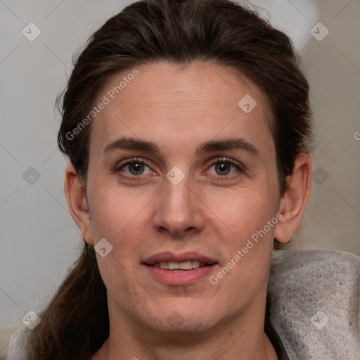 Joyful white adult female with short  brown hair and grey eyes