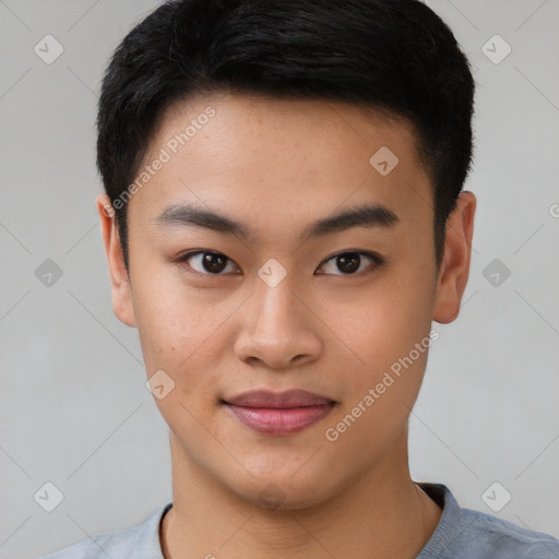 Joyful asian young-adult male with short  brown hair and brown eyes