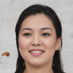 Joyful asian young-adult female with long  brown hair and brown eyes