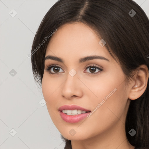 Joyful white young-adult female with long  brown hair and brown eyes