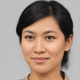 Joyful asian young-adult female with medium  brown hair and brown eyes