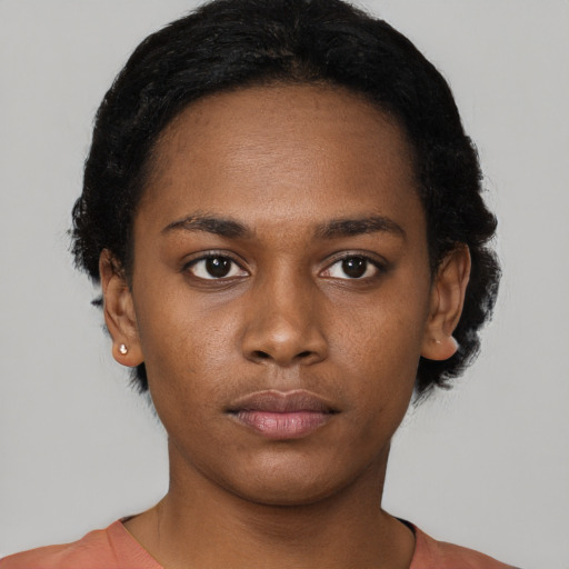 Neutral black young-adult female with short  black hair and brown eyes