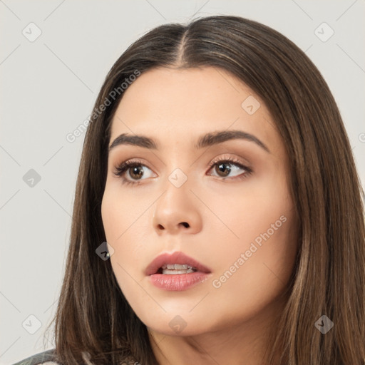 Neutral white young-adult female with long  brown hair and brown eyes