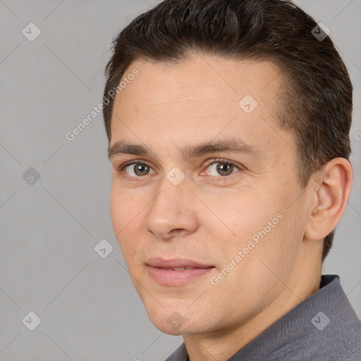 Joyful white adult male with short  brown hair and brown eyes