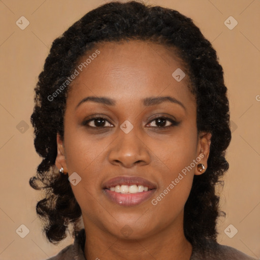 Joyful black young-adult female with long  brown hair and brown eyes
