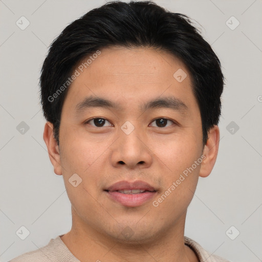 Joyful asian young-adult male with short  brown hair and brown eyes