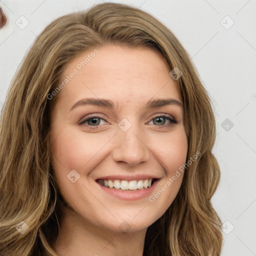 Joyful white young-adult female with long  brown hair and green eyes