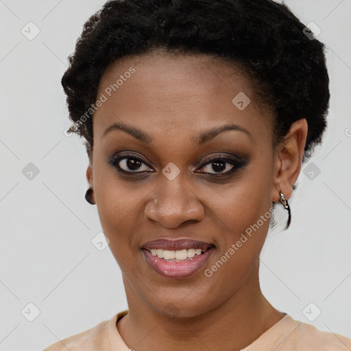 Joyful black young-adult female with short  brown hair and brown eyes