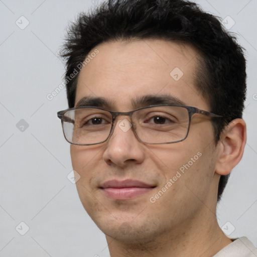 Joyful white adult male with short  brown hair and brown eyes