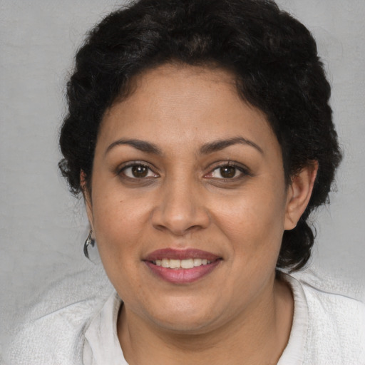 Joyful white adult female with short  brown hair and brown eyes