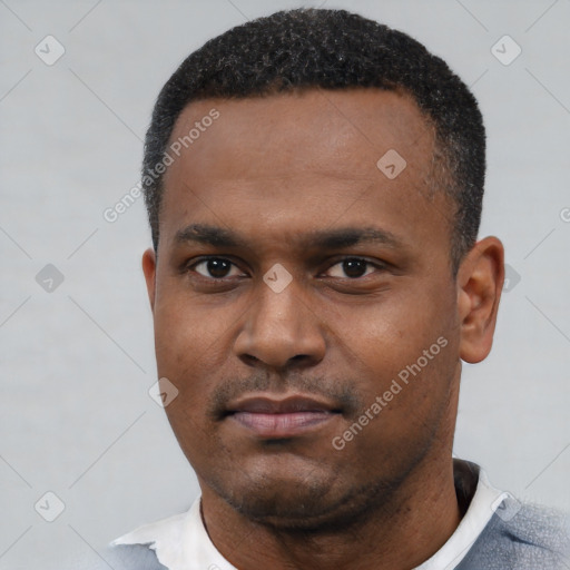 Neutral latino young-adult male with short  black hair and brown eyes