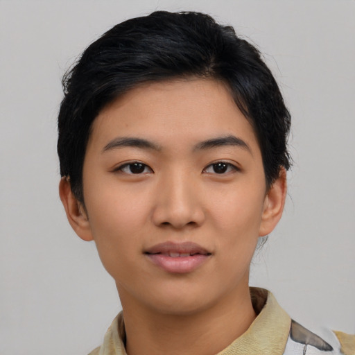 Joyful asian young-adult female with short  black hair and brown eyes