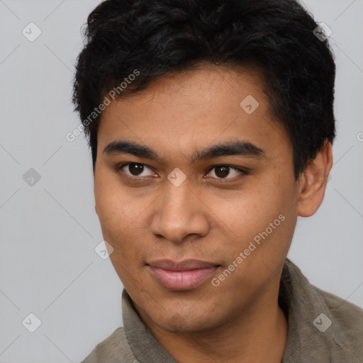 Joyful latino young-adult male with short  brown hair and brown eyes