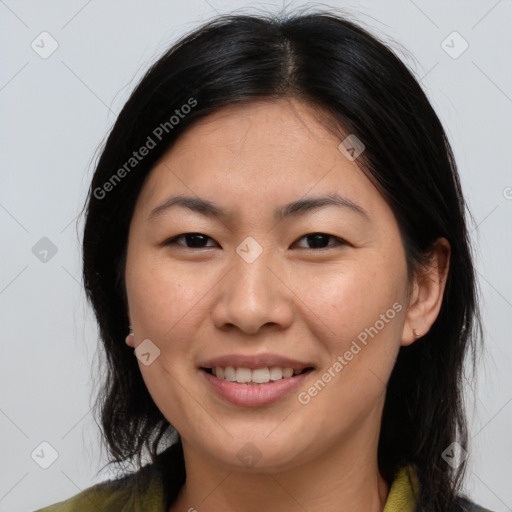 Joyful asian young-adult female with medium  brown hair and brown eyes