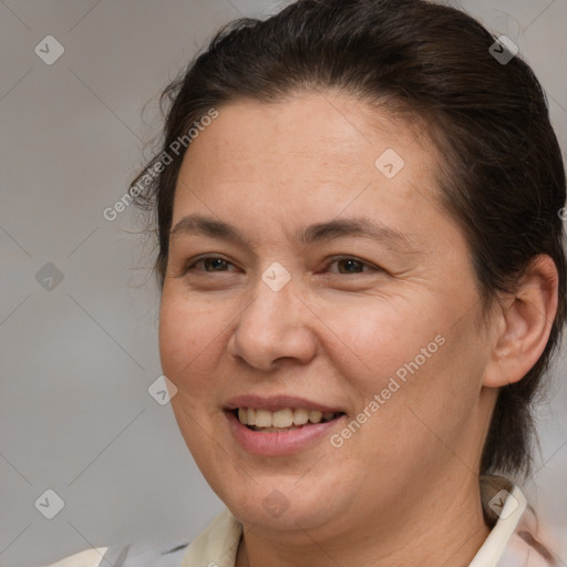 Joyful white adult female with medium  brown hair and brown eyes