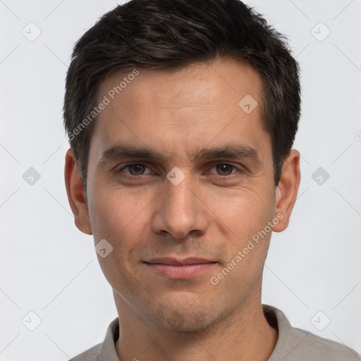 Joyful white adult male with short  brown hair and brown eyes