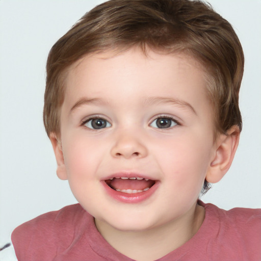 Joyful white child male with short  brown hair and brown eyes