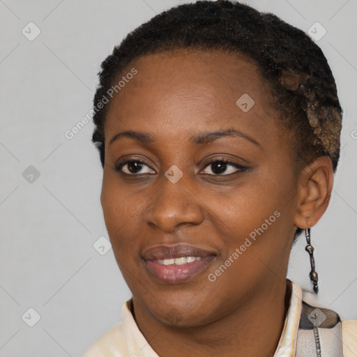 Joyful black young-adult female with short  brown hair and brown eyes