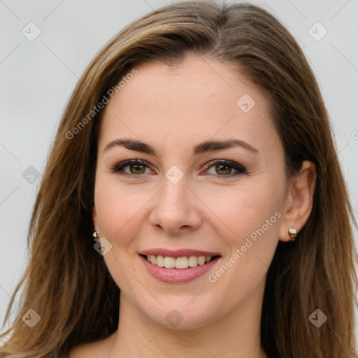 Joyful white young-adult female with long  brown hair and brown eyes