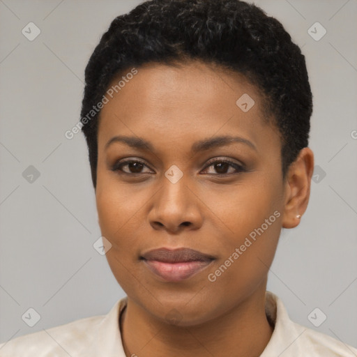 Joyful black young-adult female with short  brown hair and brown eyes