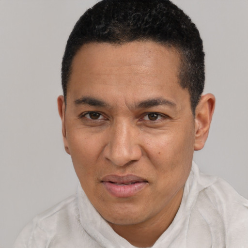 Joyful white adult male with short  black hair and brown eyes