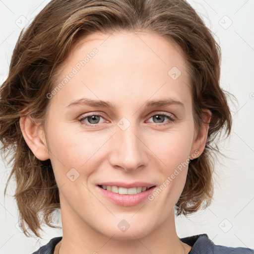 Joyful white young-adult female with medium  brown hair and blue eyes