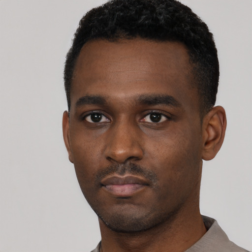 Neutral black young-adult male with short  black hair and brown eyes