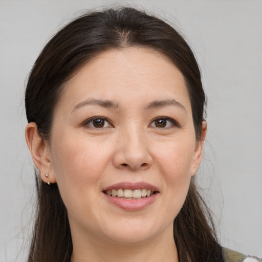 Joyful white young-adult female with medium  brown hair and brown eyes