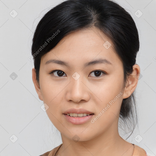 Joyful asian young-adult female with medium  black hair and brown eyes