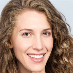 Joyful white young-adult female with long  brown hair and green eyes