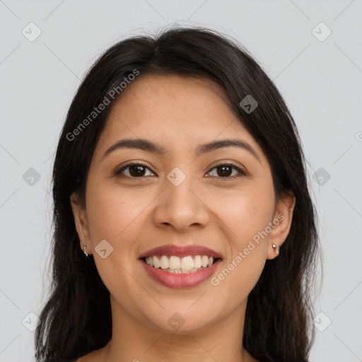 Joyful latino young-adult female with long  brown hair and brown eyes