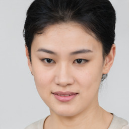 Joyful asian young-adult female with short  brown hair and brown eyes