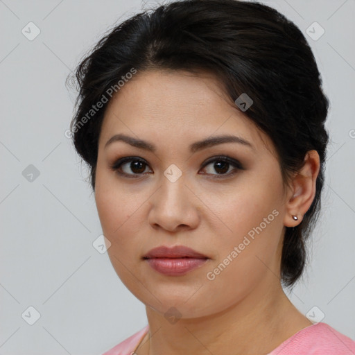 Joyful latino young-adult female with medium  brown hair and brown eyes