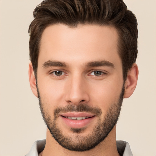 Joyful white young-adult male with short  brown hair and brown eyes