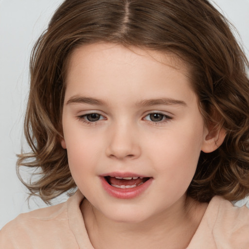 Joyful white child female with medium  brown hair and brown eyes