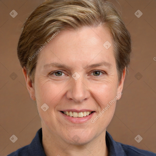 Joyful white adult female with short  brown hair and grey eyes