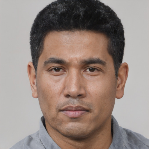Neutral asian adult male with short  black hair and brown eyes