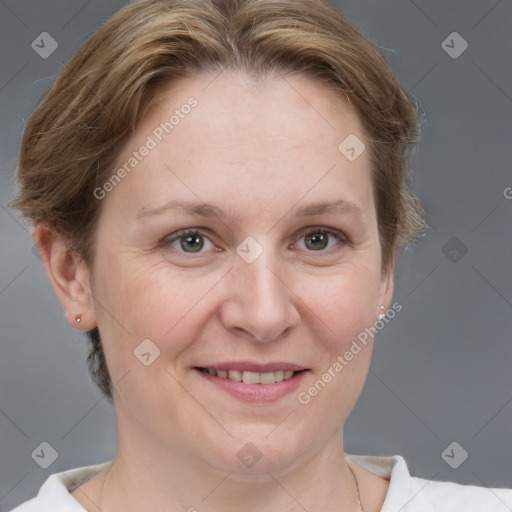 Joyful white adult female with short  brown hair and grey eyes