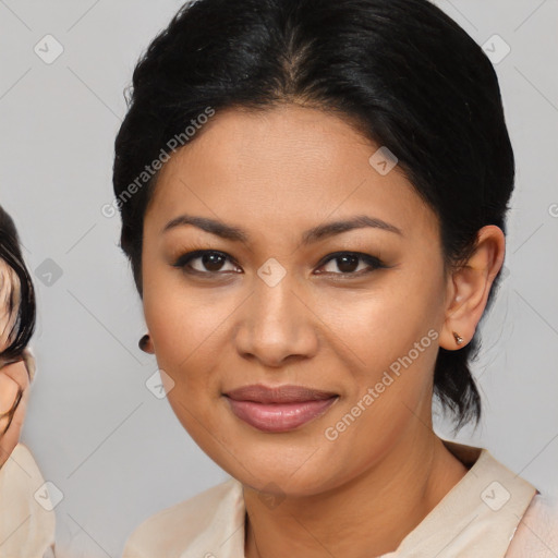 Joyful latino young-adult female with medium  brown hair and brown eyes