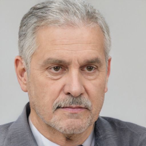 Neutral white middle-aged male with short  gray hair and brown eyes