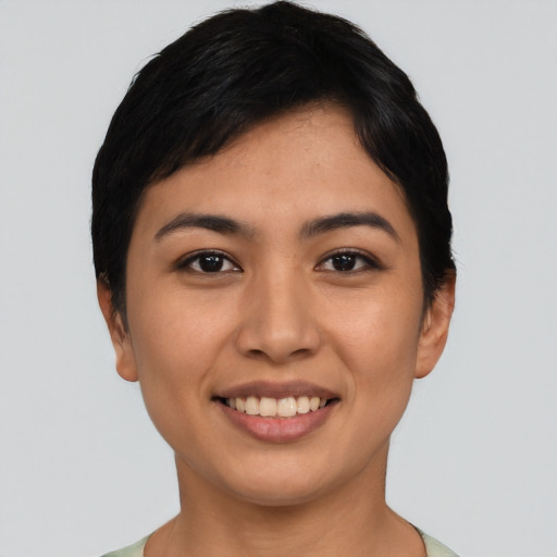 Joyful asian young-adult female with short  black hair and brown eyes