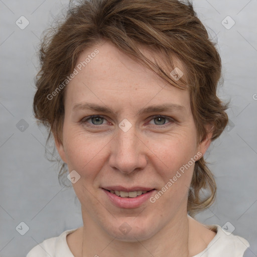 Joyful white adult female with medium  brown hair and blue eyes