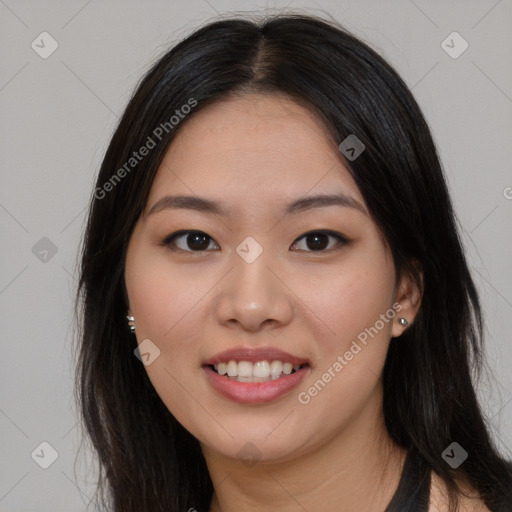 Joyful asian young-adult female with long  brown hair and brown eyes