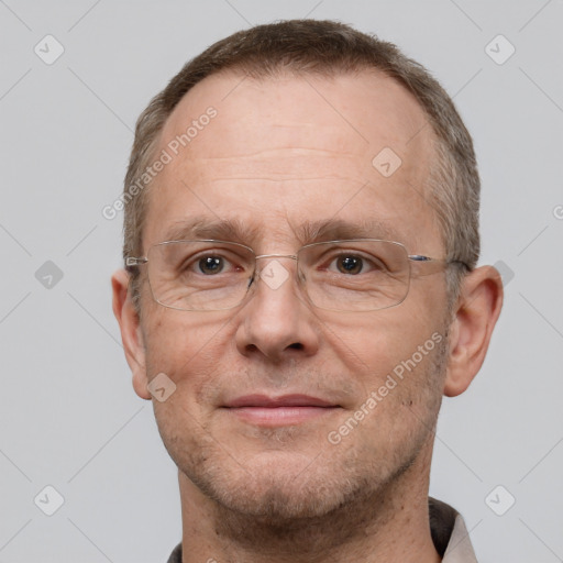 Joyful white adult male with short  brown hair and brown eyes