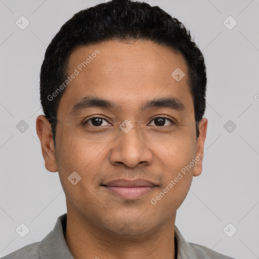 Joyful latino young-adult male with short  black hair and brown eyes